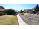 Cozy homes line a sidewalk with green lawns and desert landscaping adding charm to this community at 13642 S 42Nd St, Phoenix, AZ 85044