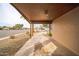 View from the carport showcasing the exterior brickwork and neighborhood views at 1403 N Oleander St, Tempe, AZ 85288