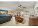 Open dining room with modern table, stylish decor, and abundant natural light at 1407 E Laguna Dr, Tempe, AZ 85282