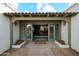 Inviting entryway with a decorative tile roof and flagstone walkway at 1407 E Laguna Dr, Tempe, AZ 85282