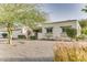 Charming single-story home with low maintenance desert landscaping at 1407 E Laguna Dr, Tempe, AZ 85282