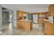 Open kitchen with wood cabinets, modern appliances, and lots of counter space at 1407 E Laguna Dr, Tempe, AZ 85282
