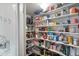 Walk-in pantry featuring ample shelving space for organized food and kitchen storage solutions at 1407 E Laguna Dr, Tempe, AZ 85282