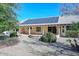 Beautiful backyard featuring desert landscaping, solar panels, and a covered patio, perfect for enjoying the outdoors at 14617 W Windcrest Dr, Sun City West, AZ 85375