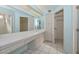 Light and airy bathroom featuring dual sinks, vanity area, and plenty of storage space at 14617 W Windcrest Dr, Sun City West, AZ 85375