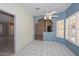 Bright breakfast room with shuttered windows and tile flooring at 14617 W Windcrest Dr, Sun City West, AZ 85375