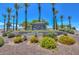 Inviting 'Welcome to Sun City West' sign with vibrant floral landscaping at 14617 W Windcrest Dr, Sun City West, AZ 85375