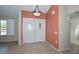 Bright foyer featuring double entry doors, tile flooring, neutral walls, and a modern light fixture at 14617 W Windcrest Dr, Sun City West, AZ 85375