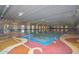 Bright indoor pool with ample natural light and access to seating areas at 14617 W Windcrest Dr, Sun City West, AZ 85375