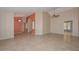 Spacious living room with neutral color palette, tile flooring, arched doorways, and ceiling fan at 14617 W Windcrest Dr, Sun City West, AZ 85375