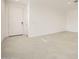 Bright entryway with neutral tile flooring, white walls, and a front door at 14968 W Hackamore Dr, Surprise, AZ 85387