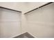 Bright walk-in closet featuring ample shelving and a convenient clothing rod for easy organization at 14968 W Hackamore Dr, Surprise, AZ 85387