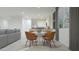 Open-concept dining area adjacent to the kitchen and living room, illuminated by recessed lighting at 15052 W Hackamore Dr, Surprise, AZ 85387