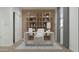 Well-lit home office with built-in shelving and a comfortable workspace at 15052 W Hackamore Dr, Surprise, AZ 85387