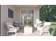 Relaxing covered patio with comfortable seating and views of the backyard and open kitchen at 15052 W Hackamore Dr, Surprise, AZ 85387