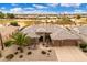 Aerial view of a well-maintained home with desert landscaping and three-car garage at 15558 W Big Sky Dr, Surprise, AZ 85374