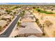 A high angle aerial view of a residential neighborhood, and a golf course at 15558 W Big Sky Dr, Surprise, AZ 85374