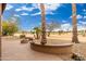 Beautiful backyard with desert landscaping, fire pit and views of the golf course at 15558 W Big Sky Dr, Surprise, AZ 85374