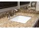Bathroom featuring a white sink, chrome fixtures, and granite countertop at 15558 W Big Sky Dr, Surprise, AZ 85374