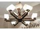 Unique chandelier with geometric design and soft lighting, adding character to the home's interior at 15558 W Big Sky Dr, Surprise, AZ 85374