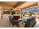 Comfortable covered patio featuring an outdoor living room with comfortable seating and serene views at 15558 W Big Sky Dr, Surprise, AZ 85374