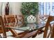 Dining room featuring a glass-topped table with wooden chairs, a decorative vase, and ample natural light at 15558 W Big Sky Dr, Surprise, AZ 85374