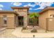 Inviting front entrance features a stone facade and desert landscaping at 15558 W Big Sky Dr, Surprise, AZ 85374