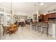 Spacious great room featuring open-concept living and dining areas with tile flooring and natural light at 15558 W Big Sky Dr, Surprise, AZ 85374