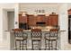Beautiful kitchen featuring granite countertops, stainless steel appliances, and a breakfast bar with seating at 15558 W Big Sky Dr, Surprise, AZ 85374