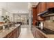 Updated kitchen with granite counters, stainless appliances, and seamless flow to the bright living space at 15558 W Big Sky Dr, Surprise, AZ 85374