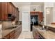 A gourmet kitchen featuring granite countertops, stainless steel appliances, and ample cabinet space at 15558 W Big Sky Dr, Surprise, AZ 85374