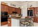 Modern kitchen with granite countertops, stainless steel appliances and breakfast bar at 15558 W Big Sky Dr, Surprise, AZ 85374