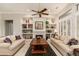 Comfortable living room with plush sofas, a ceiling fan, and tile floors at 15558 W Big Sky Dr, Surprise, AZ 85374