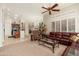 Open-concept living area with seamless transition from kitchen, offering ample natural light and comfortable furnishings at 15558 W Big Sky Dr, Surprise, AZ 85374