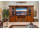Living room showcasing built-in entertainment center, and comfortable seating area at 15558 W Big Sky Dr, Surprise, AZ 85374