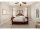 Cozy bedroom with a large, comfortable bed, shutters on the windows, and neutral tones at 15558 W Big Sky Dr, Surprise, AZ 85374