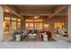 Inviting covered patio with stylish furniture, creating an ideal space for relaxation and social gatherings at 15558 W Big Sky Dr, Surprise, AZ 85374