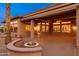 Covered patio with outdoor fire pit and backyard view at 15558 W Big Sky Dr, Surprise, AZ 85374