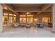 Spacious covered patio with multiple seating arrangements, perfect for enjoying the outdoor ambiance at 15558 W Big Sky Dr, Surprise, AZ 85374