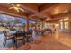 Large, inviting patio with a golf course view is furnished with comfortable seating options for relaxing and entertaining at 15558 W Big Sky Dr, Surprise, AZ 85374