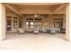 Large covered patio featuring seating areas and views, ideal for enjoying the outdoors in comfort and style at 15558 W Big Sky Dr, Surprise, AZ 85374