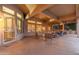 Enclosed patio area with comfortable seating and outdoor heater, offering a cozy spot for relaxation and social gatherings at 15558 W Big Sky Dr, Surprise, AZ 85374