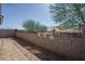 Backyard featuring block wall and views of the community pool at 16213 W Soft Wind Dr, Surprise, AZ 85387