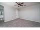 Bedroom with a ceiling fan and neutral carpeting, ready for personalization and relaxation at 16213 W Soft Wind Dr, Surprise, AZ 85387