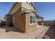 Exterior view of home showcasing the backyard and covered patio at 16213 W Soft Wind Dr, Surprise, AZ 85387