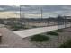 View of fenced pickleball court in a residential community at 16213 W Soft Wind Dr, Surprise, AZ 85387