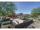 Community playground with picnic shelter, playground, and well-maintained landscaping at 16213 W Soft Wind Dr, Surprise, AZ 85387