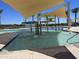 Community splash pad with overhead shade and playful water features at 16213 W Soft Wind Dr, Surprise, AZ 85387