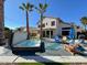 Inviting backyard with inground hot tub, lush landscaping, patio furniture, grill, and artificial grass at 17311 N Kimberly Way, Surprise, AZ 85374