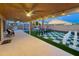 Spacious backyard with covered patio, outdoor furniture, giant chessboard, and a jacuzzi tub at 17311 N Kimberly Way, Surprise, AZ 85374